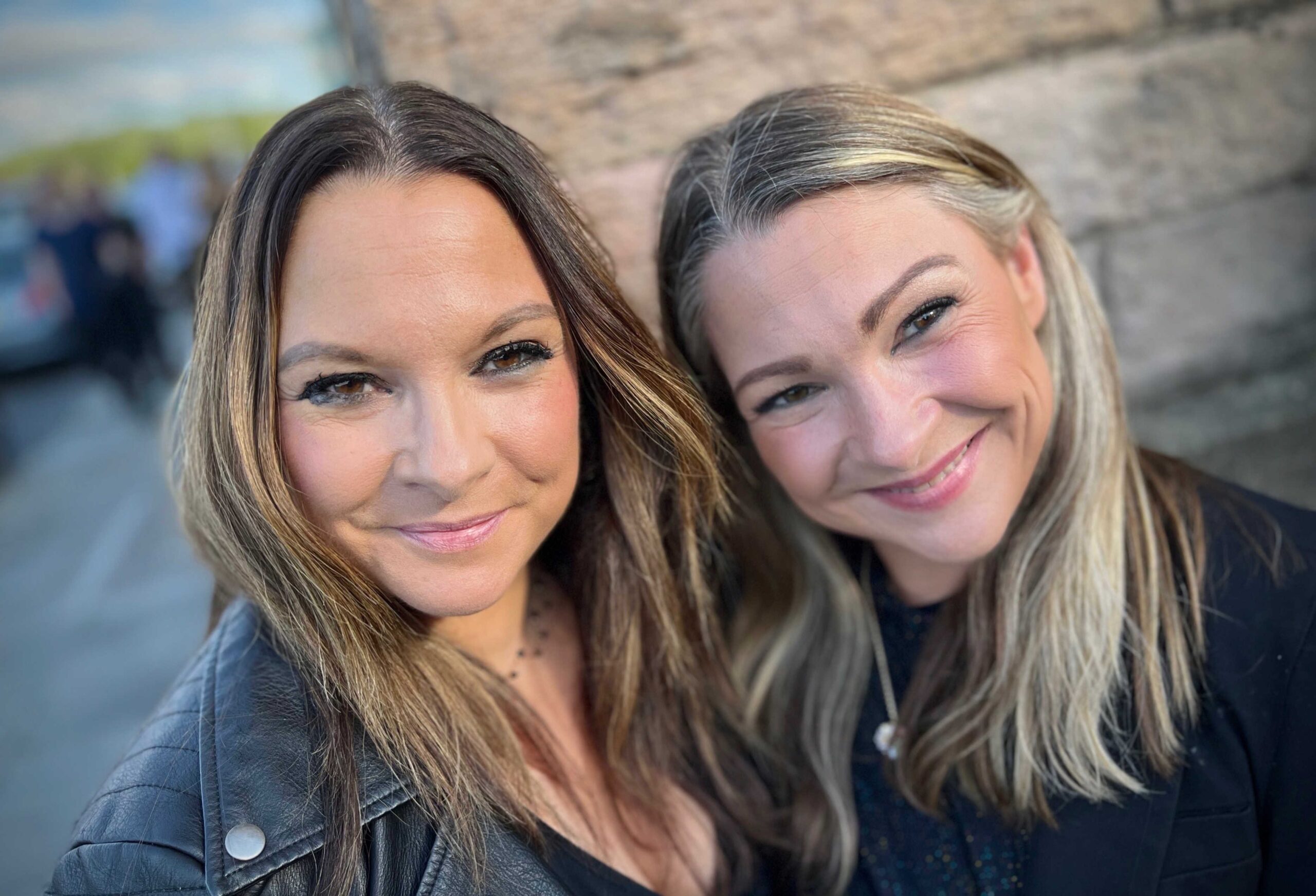 Two females looking to camera, twin sisters