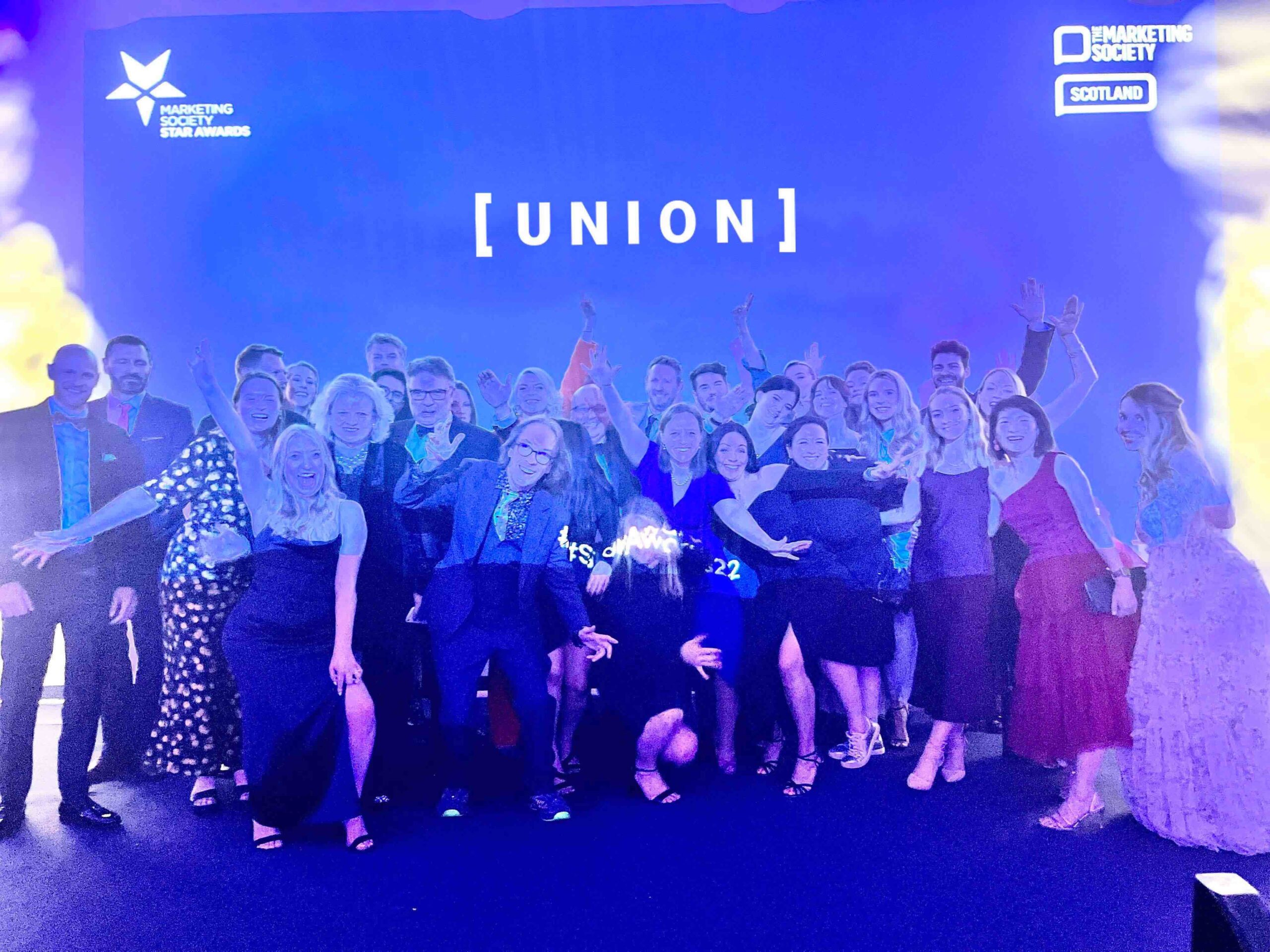 Union team on stage, group photo facing to camera at award night